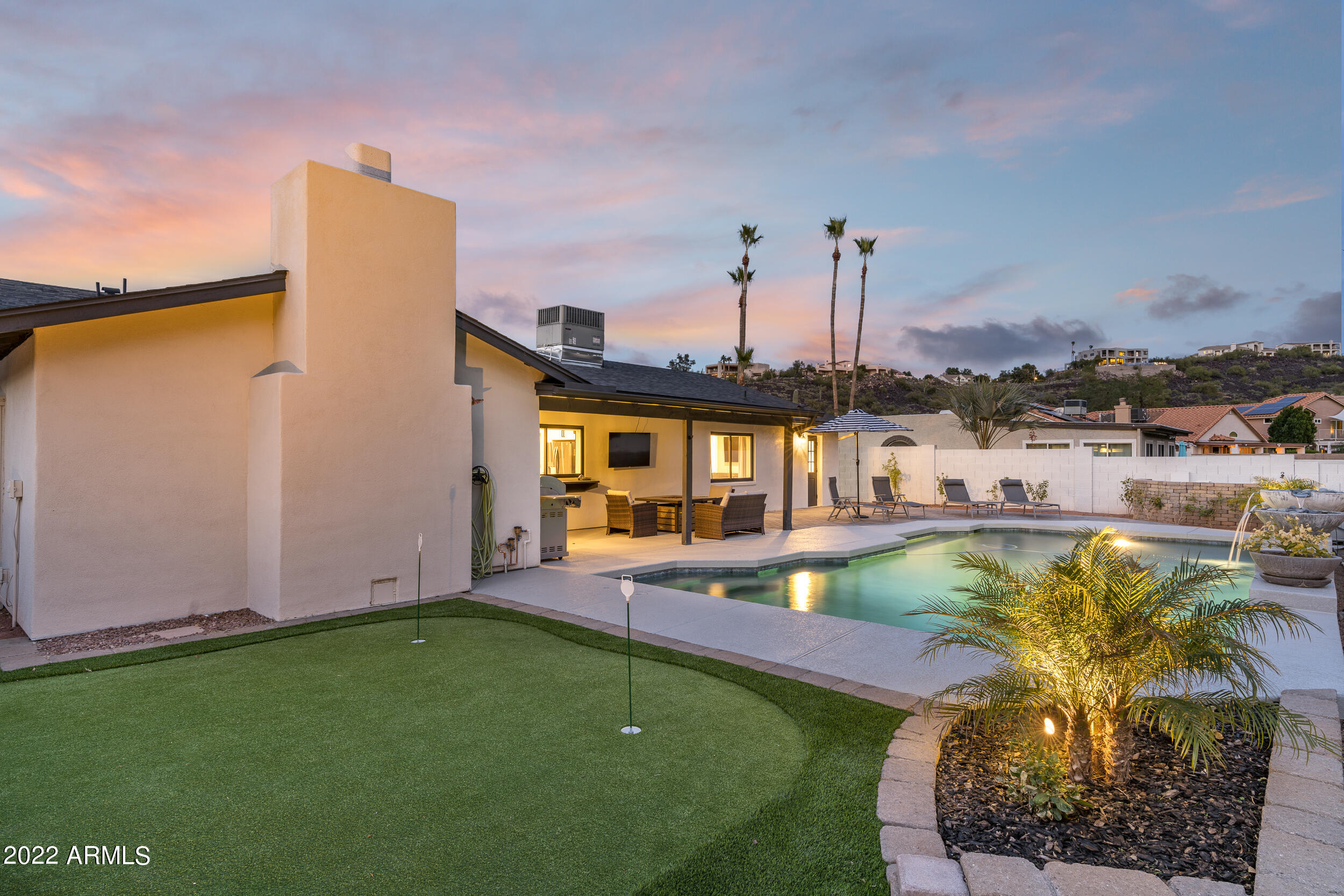 1641 West Evans Drive Phoenix, AZ 85023 - Photo 40 of 52 a view of a swimming pool with a lounge chairs
