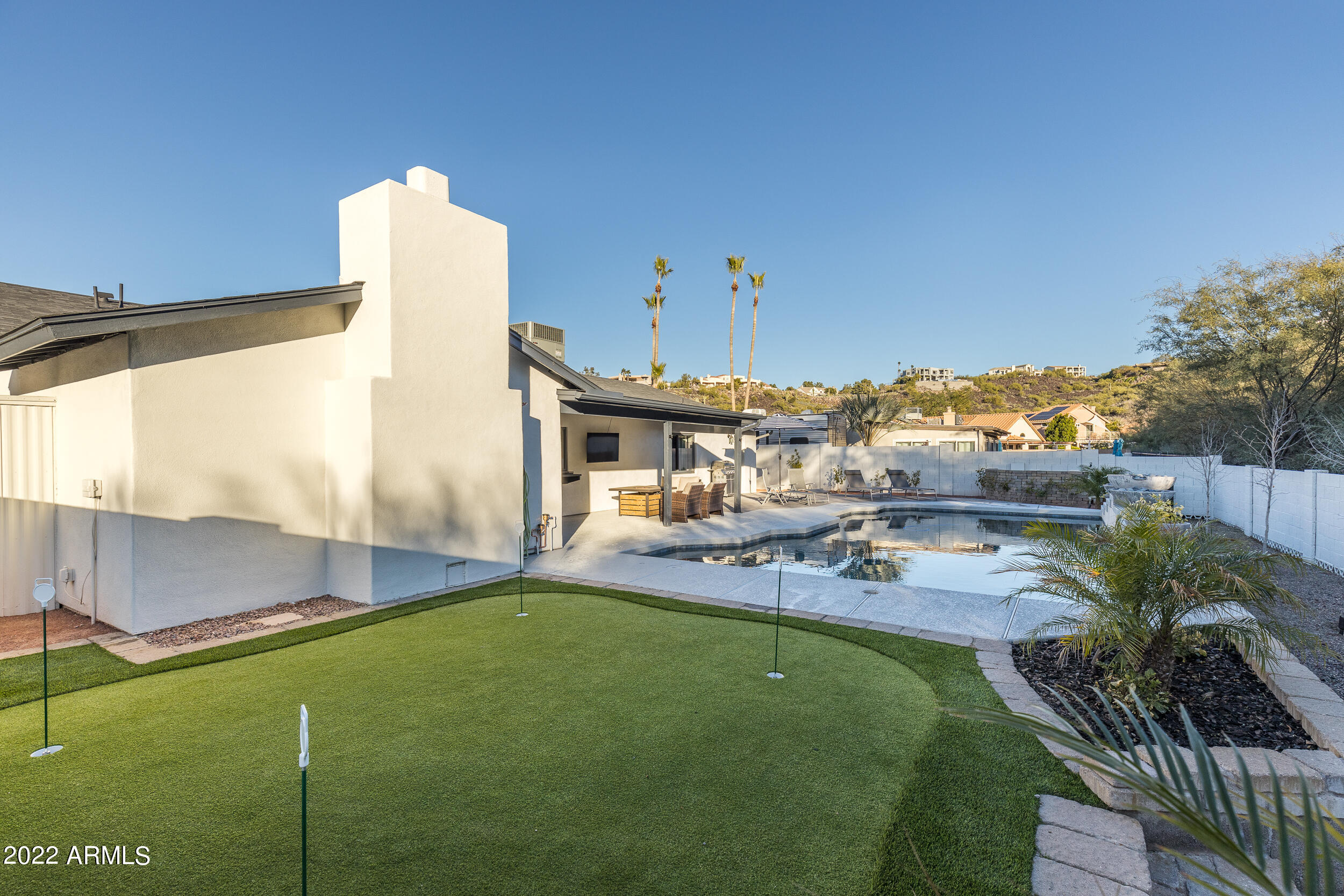 1641 West Evans Drive Phoenix, AZ 85023 - Photo 44 of 52 a view of a swimming pool with a patio