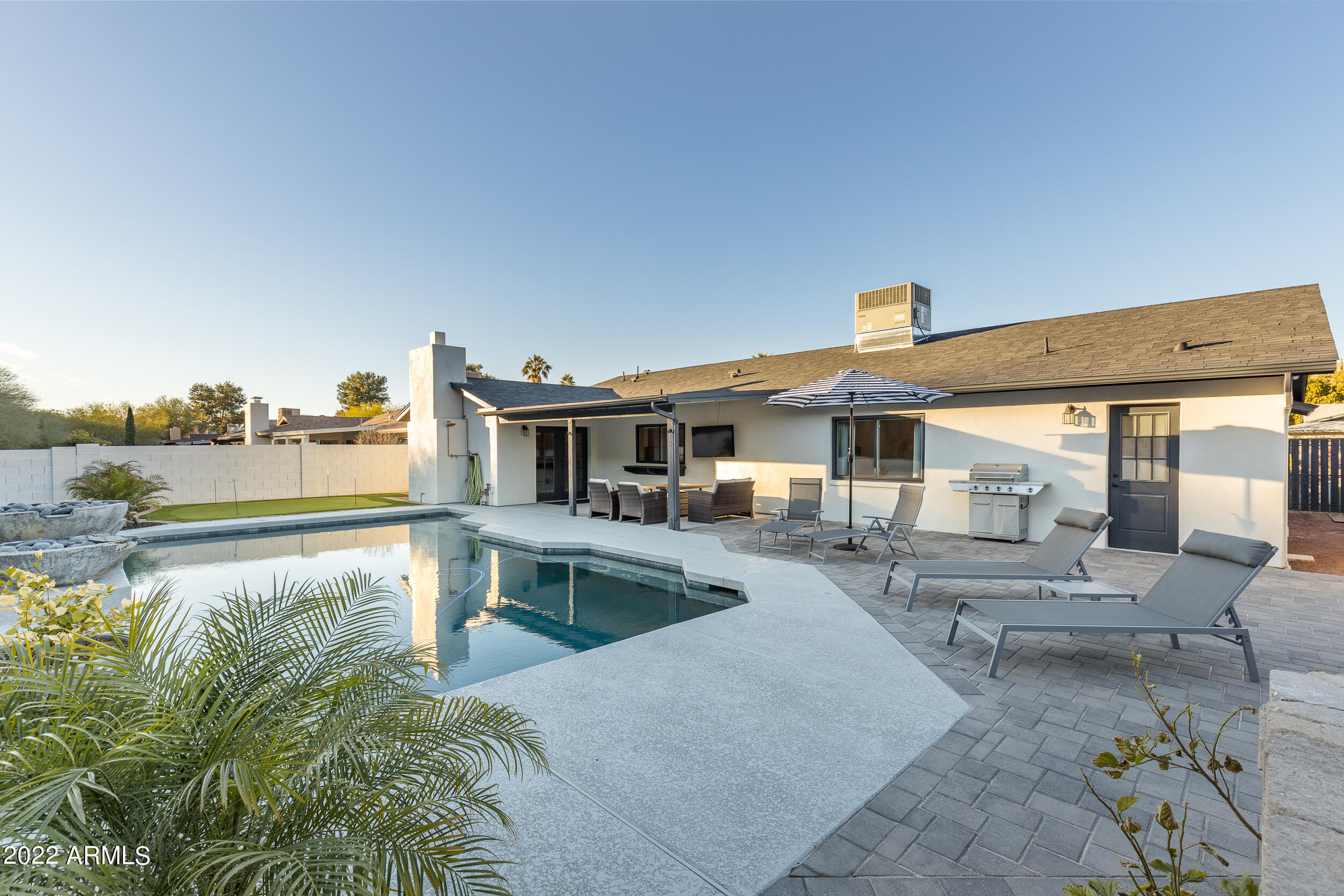 1641 West Evans Drive Phoenix, AZ 85023 - Photo 47 of 52 a view of a swimming pool with a patio