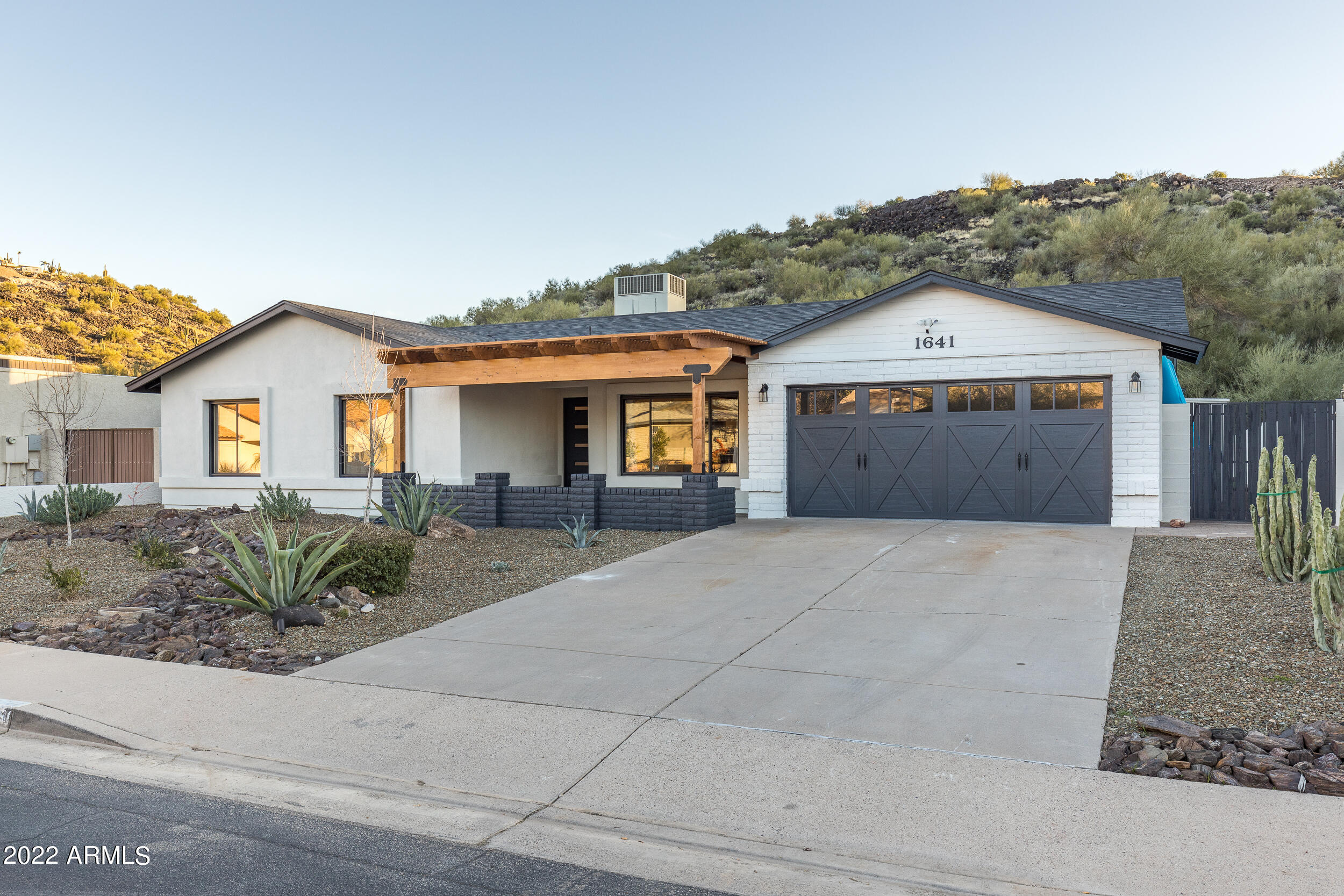 1641 West Evans Drive Phoenix, AZ 85023 - Photo 52 of 52 a front view of house with yard and trees around