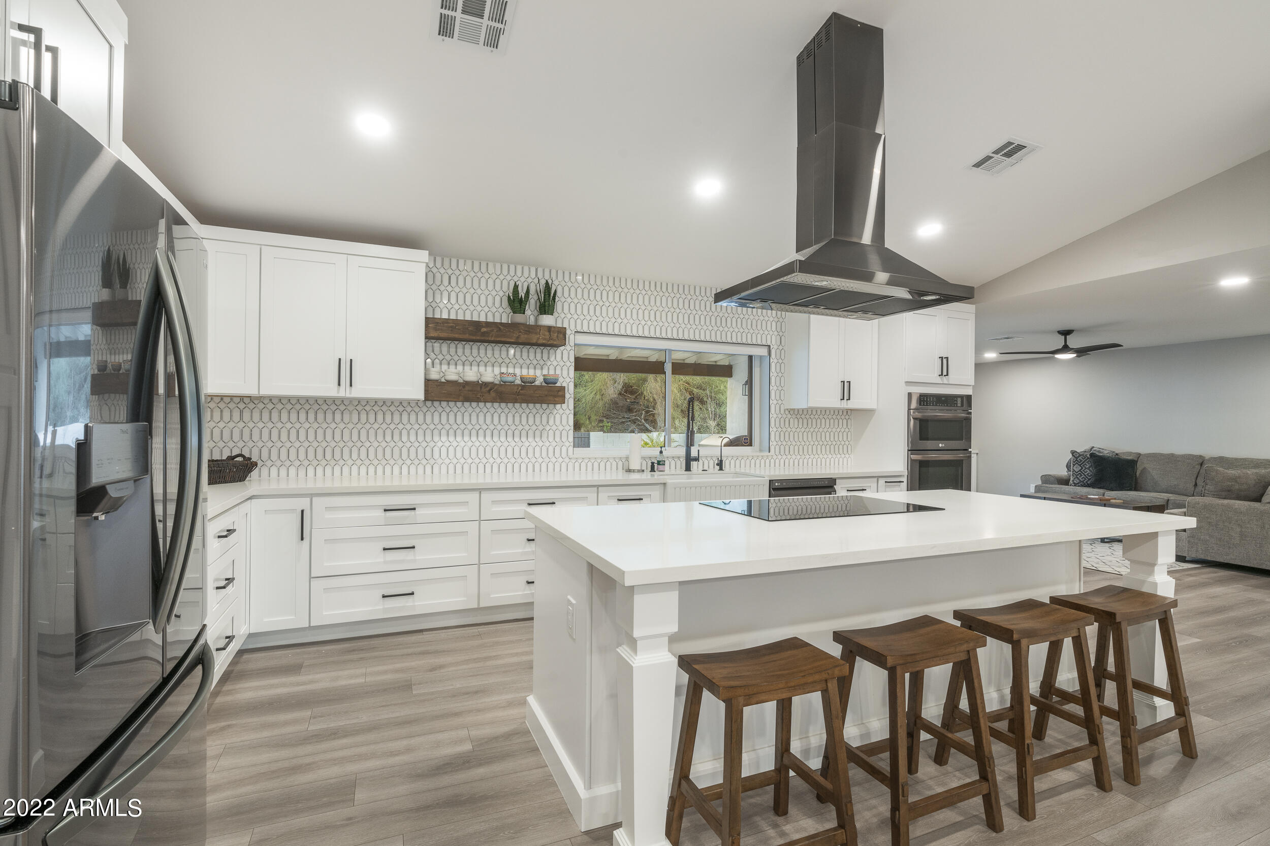 1641 West Evans Drive Phoenix, AZ 85023 - Photo 7 of 52 a kitchen with a table chairs refrigerator and microwave