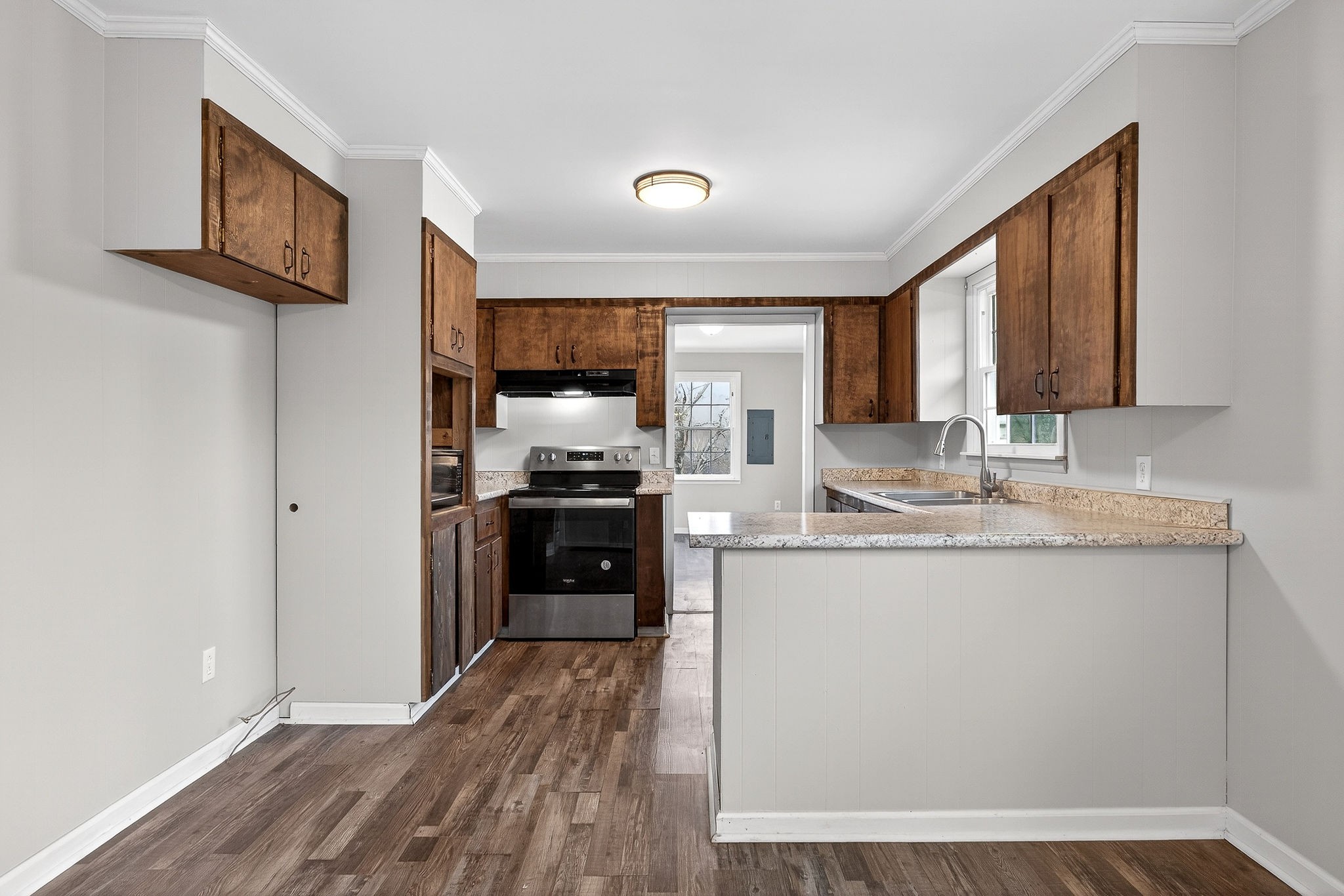 1528 Dry Creek Road McMinnville, TN 37110 - Photo 15 of 45 a kitchen with granite countertop a refrigerator stove and sink