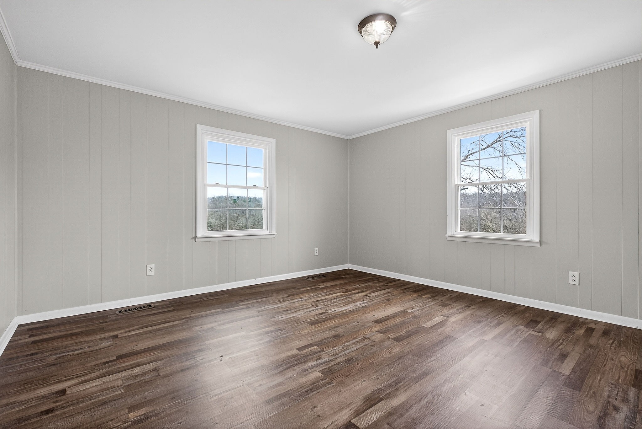 1528 Dry Creek Road McMinnville, TN 37110 - Photo 22 of 45 a view of an empty room with wooden floor and a window