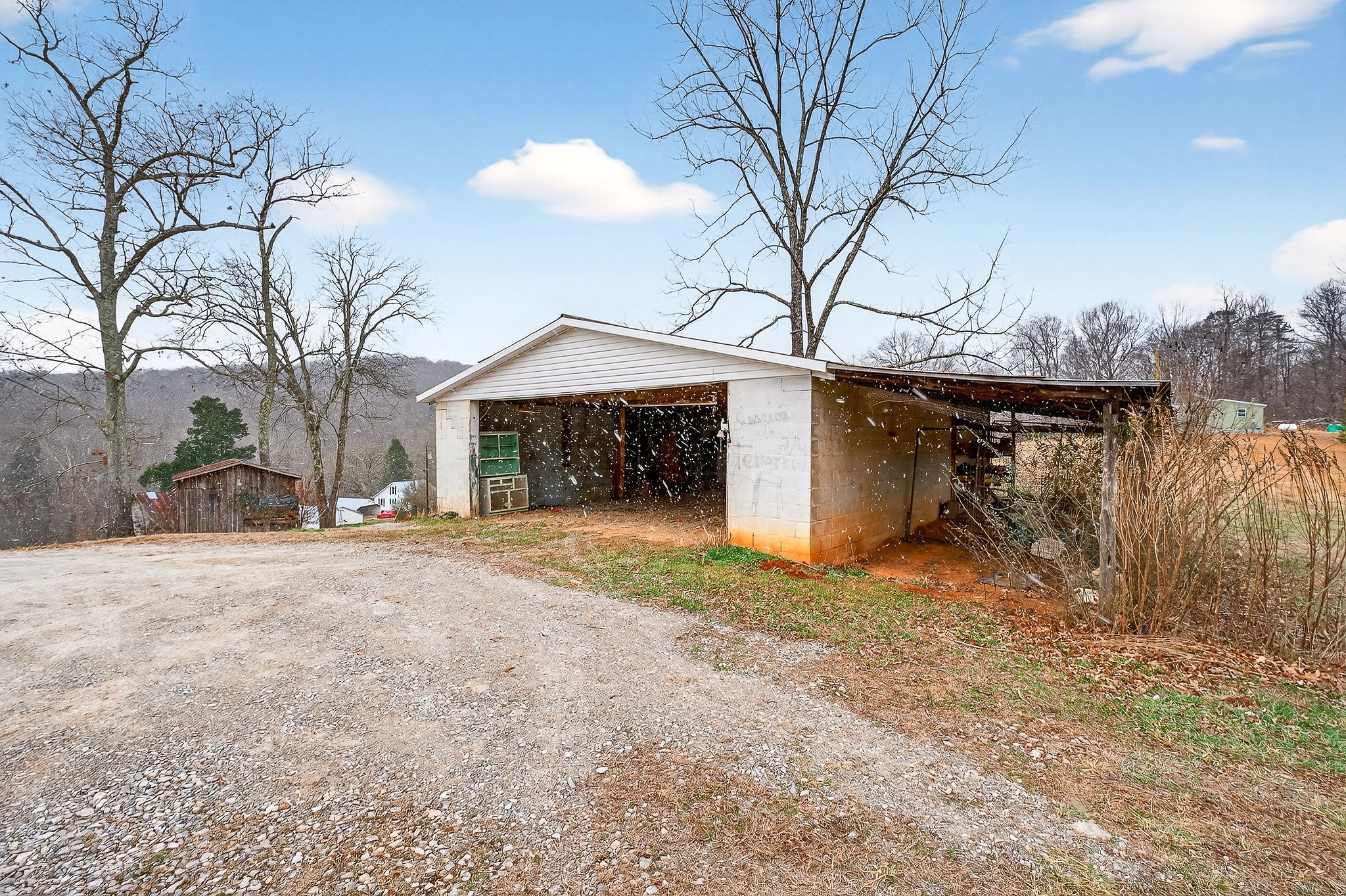 1528 Dry Creek Road McMinnville, TN 37110 - Photo 43 of 45 a front view of a house with a yard and garage