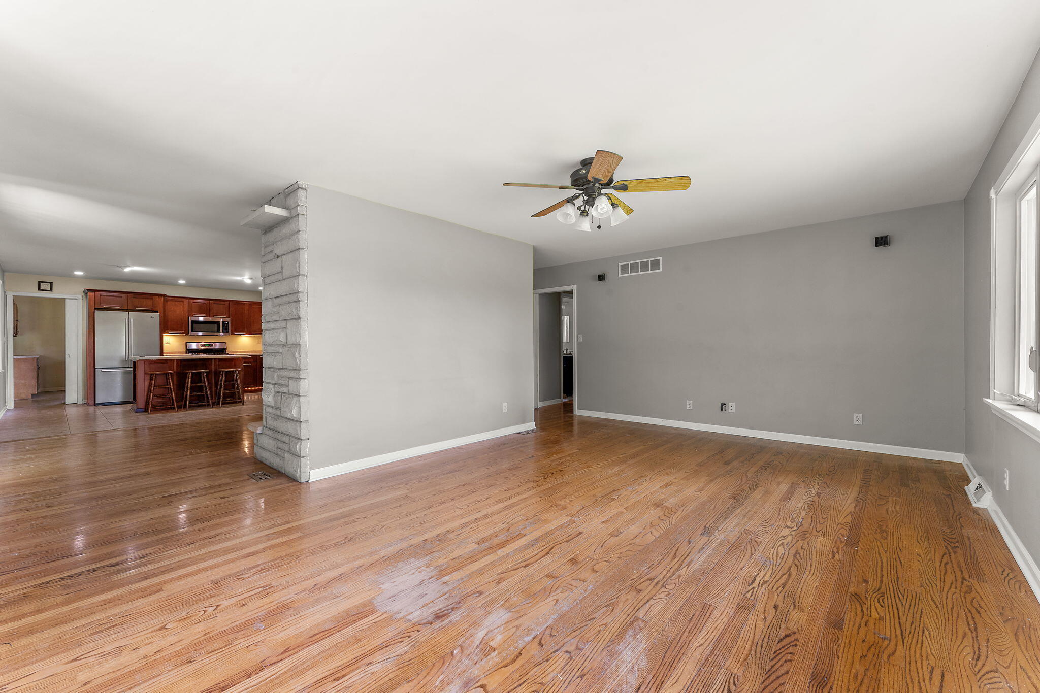 16280 Hendricks Street Lowell, IN 46356 - Photo 19 of 35 a view of room with wooden floor and ceiling fan