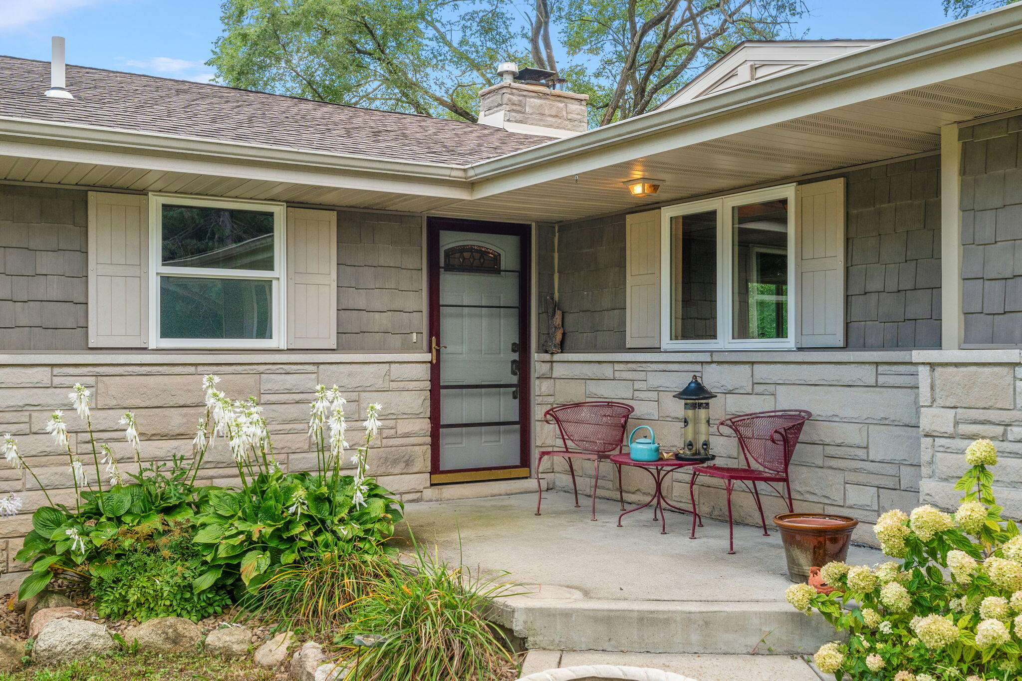 16280 Hendricks Street Lowell, IN 46356 - Photo 33 of 35 a view of a brick house with outdoor seating