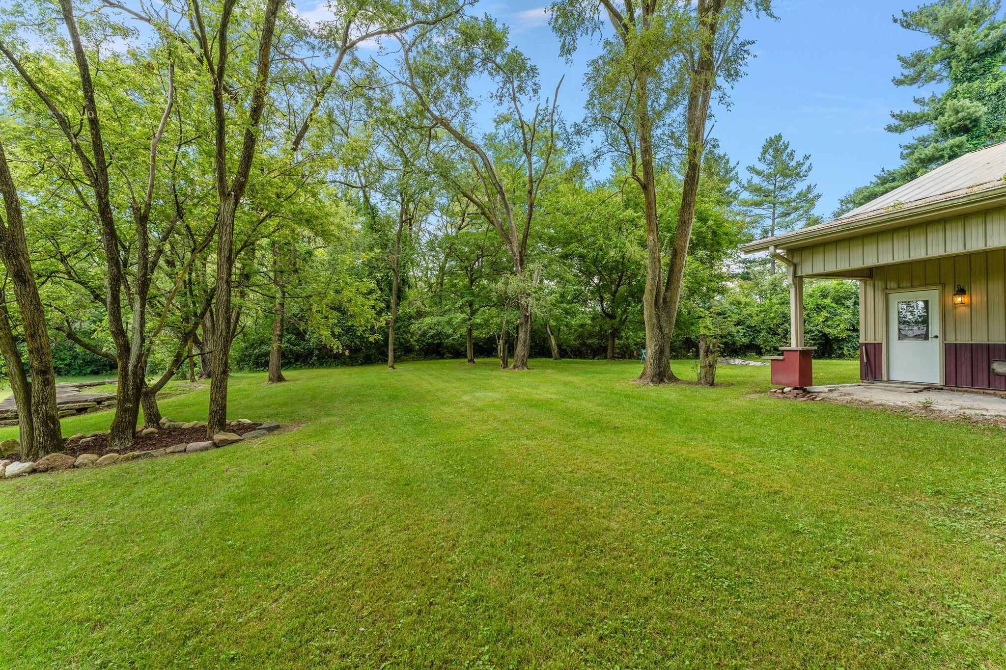 16280 Hendricks Street Lowell, IN 46356 - Photo 5 of 35 a view of a house with a backyard