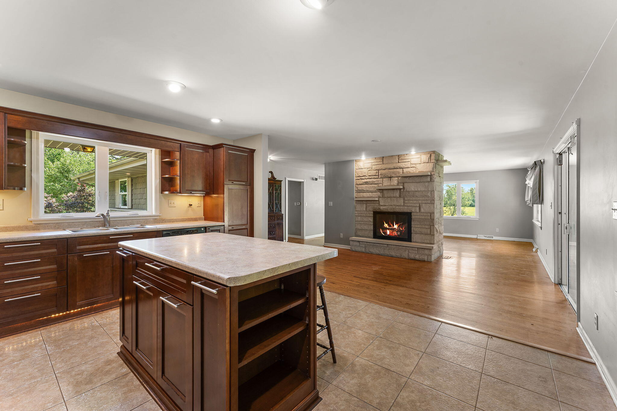 16280 Hendricks Street Lowell, IN 46356 - Photo 9 of 35 a kitchen with a stove and a wooden cabinets