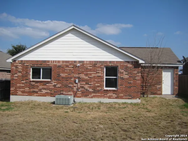 a front view of a house with brick walls