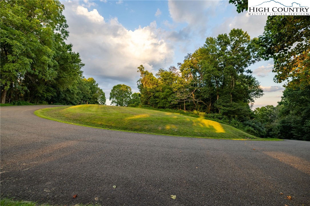 Westfield Place Lansing, NC 28643 - Photo 4 of 9 a view of a swimming pool with a yard