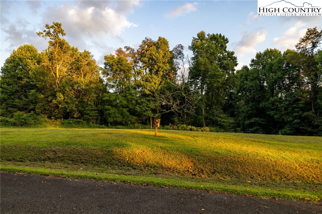 Westfield Place Lansing, NC 28643 - Photo 6 of 9 a view of a swimming pool with an outdoor space and seating area