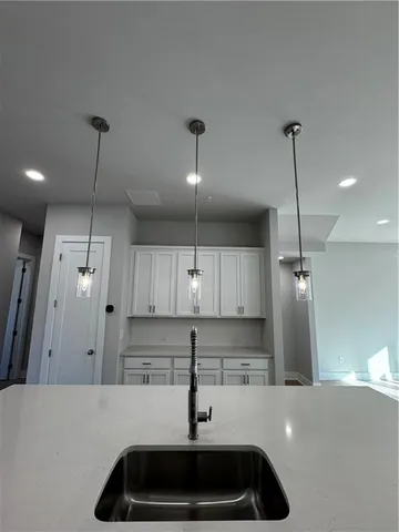 a kitchen with a sink and refrigerator