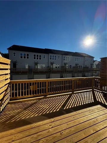 a view of deck with wooden floor and fence