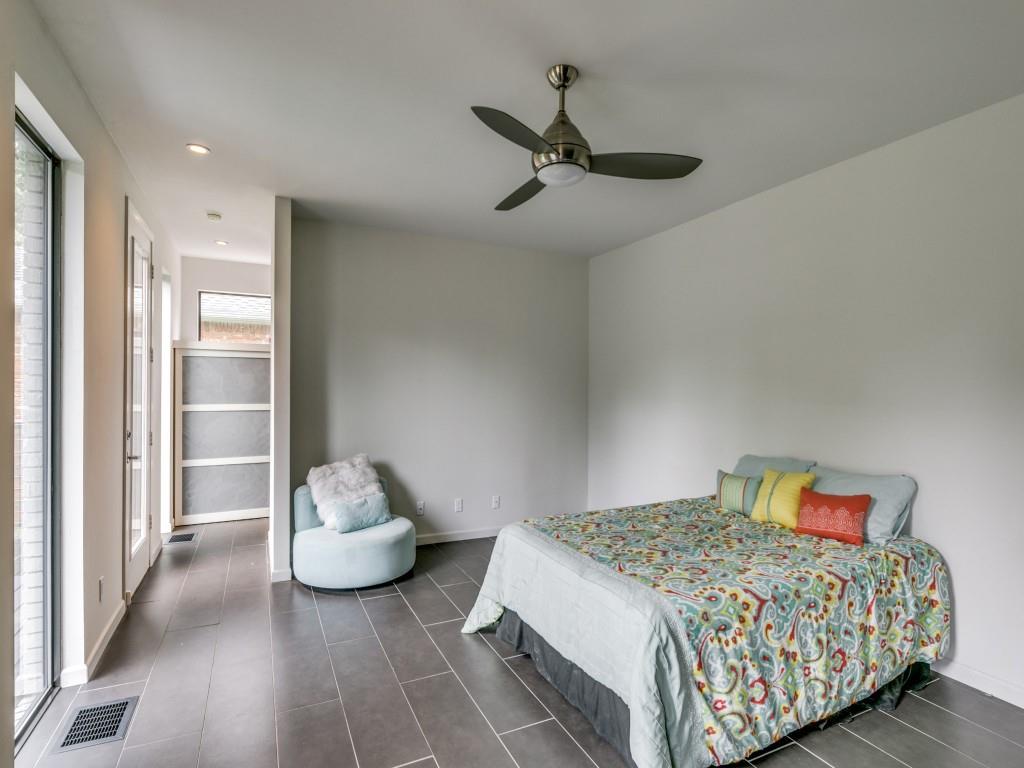 919 Knott Place Dallas, TX 75208 - Photo 14 of 25 a bedroom with a bed and a window