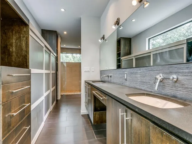 a bathroom with a bathtub and shower