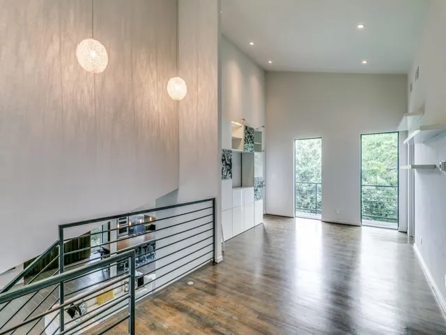 a view hallway with furniture and wooden floor