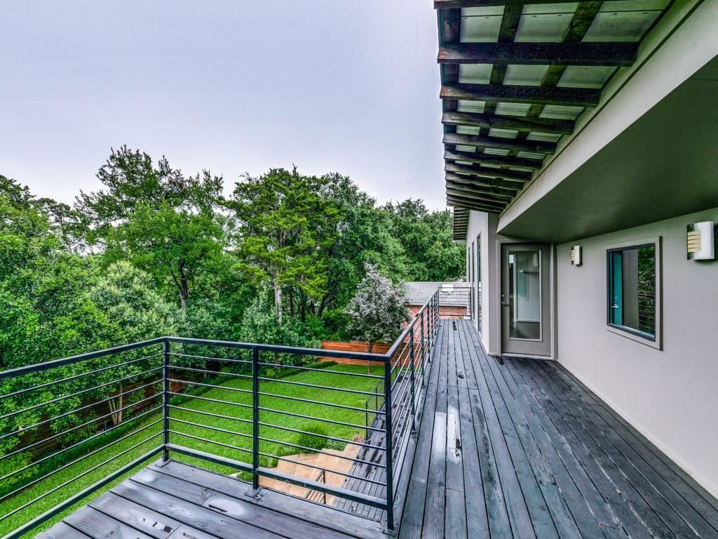 919 Knott Place Dallas, TX 75208 - Photo 20 of 25 a view of a roof deck with wooden floor and fence