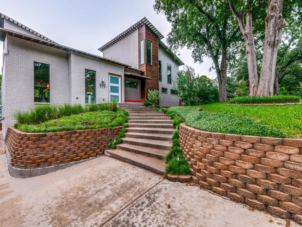 919 Knott Place Dallas, TX 75208 - Photo 2 of 25 a front view of a house with a yard