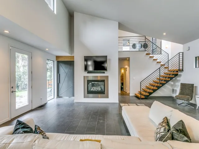 a living room with furniture and a fireplace
