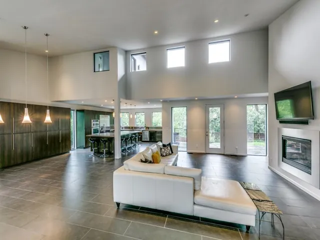 a living room with fireplace furniture and a flat screen tv