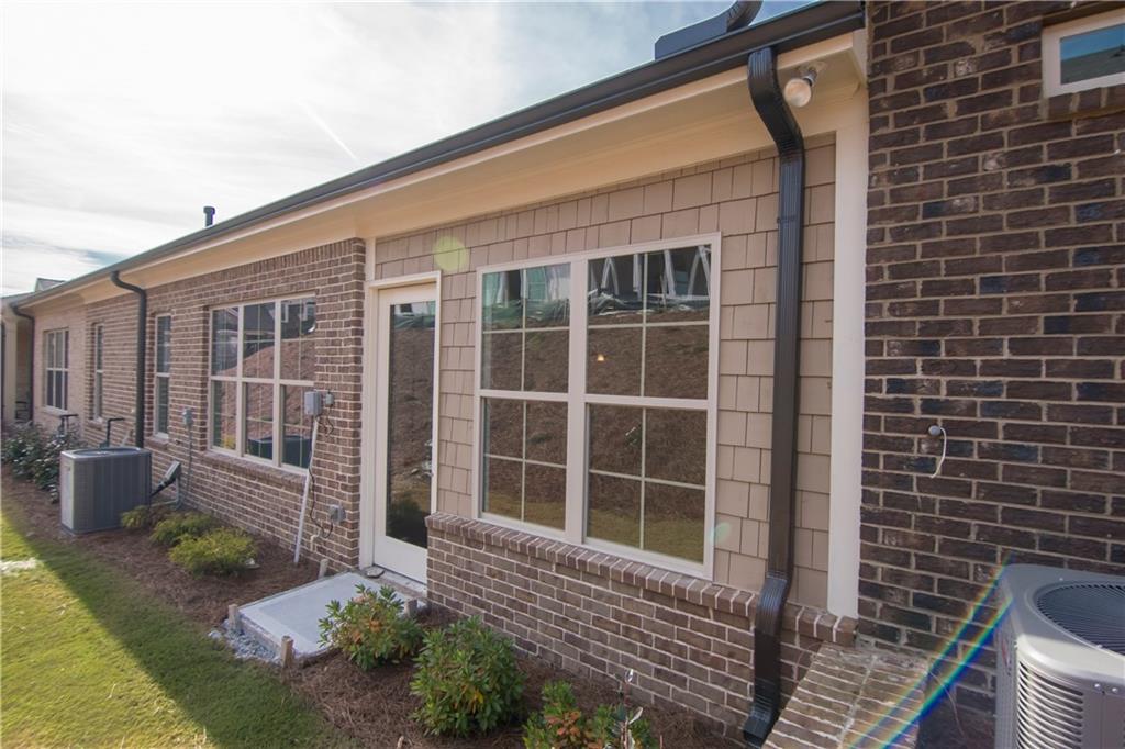 5875 Overlook Ridge East, Unit 106 Suwanee, GA 30024 - Photo 31 of 40 Picture is representative. Clubhouse and pool under construction.