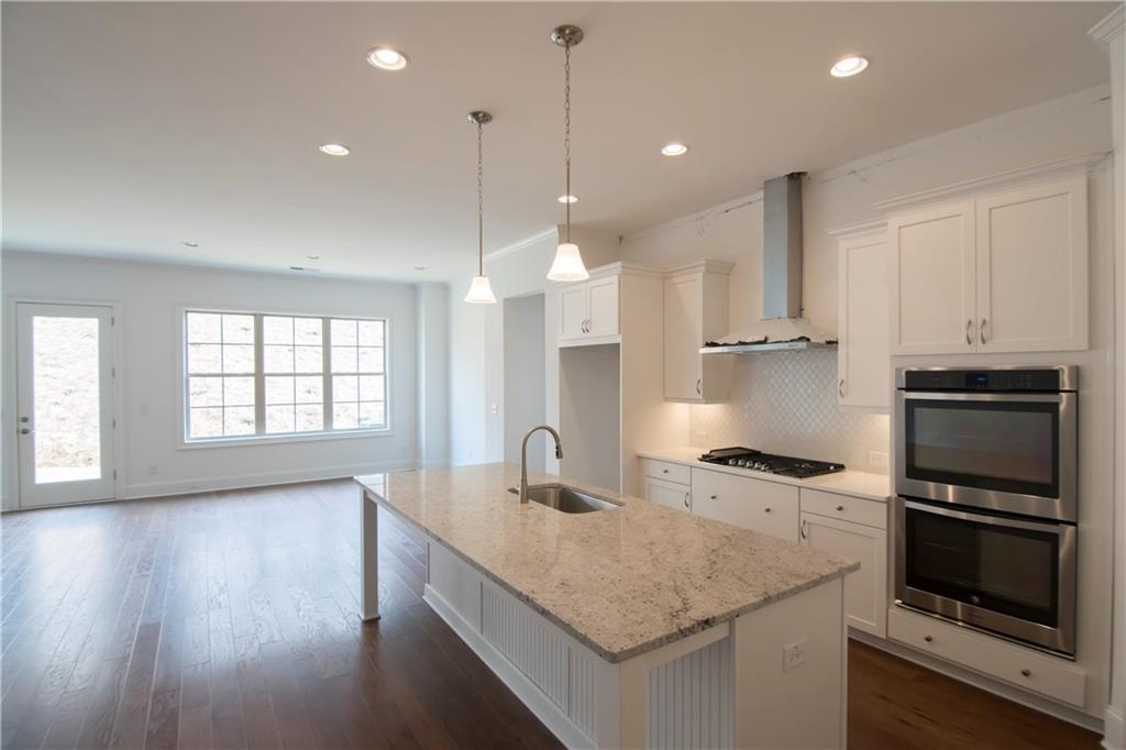 5875 Overlook Ridge East, Unit 106 Suwanee, GA 30024 - Photo 5 of 40 Picture is representative taken of Hanover Plan decorated model. Home is under construction