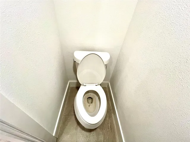 a close view of a utility room with dryer and washer