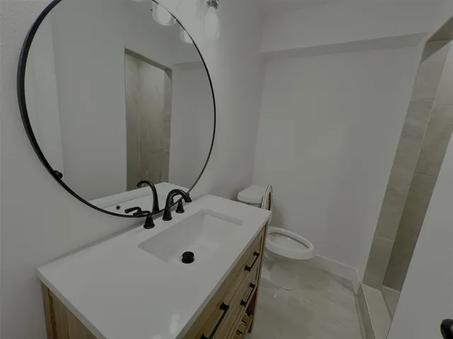 a bathroom with a sink and mirror