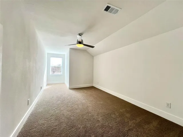 an empty room with a empty space and windows