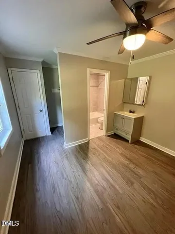 a view of a room with wooden floor and staircase