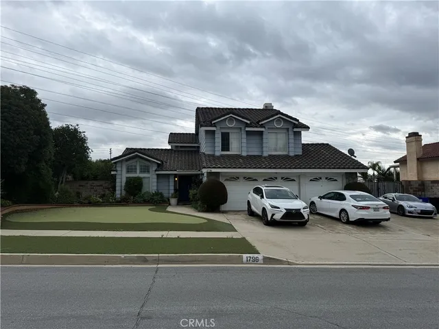 a view of a cars parked in front of a house