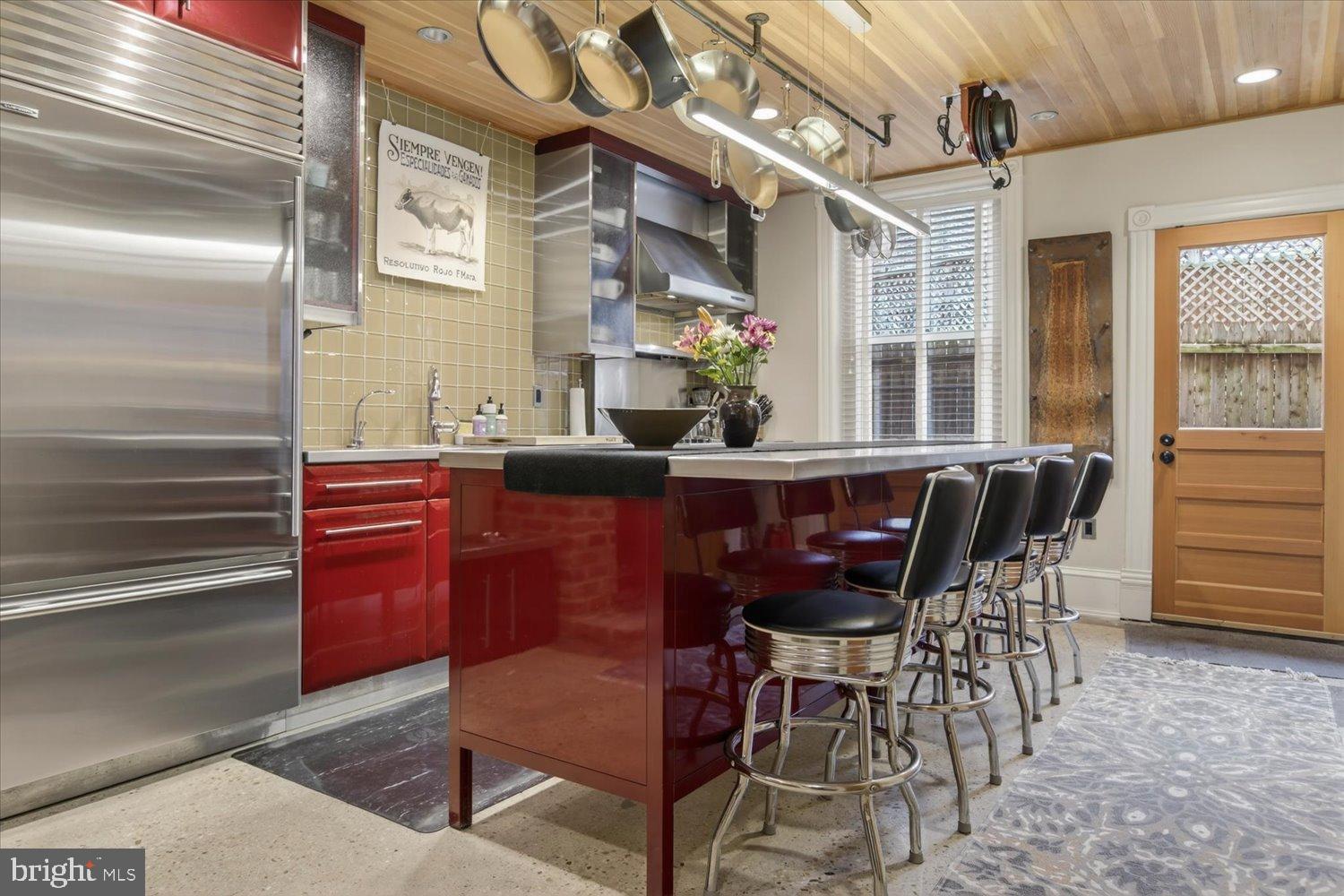 116 11th Street Northeast Washington, DC 20002 - Photo 16 of 40 Sleek red kitchen with modern elegance.