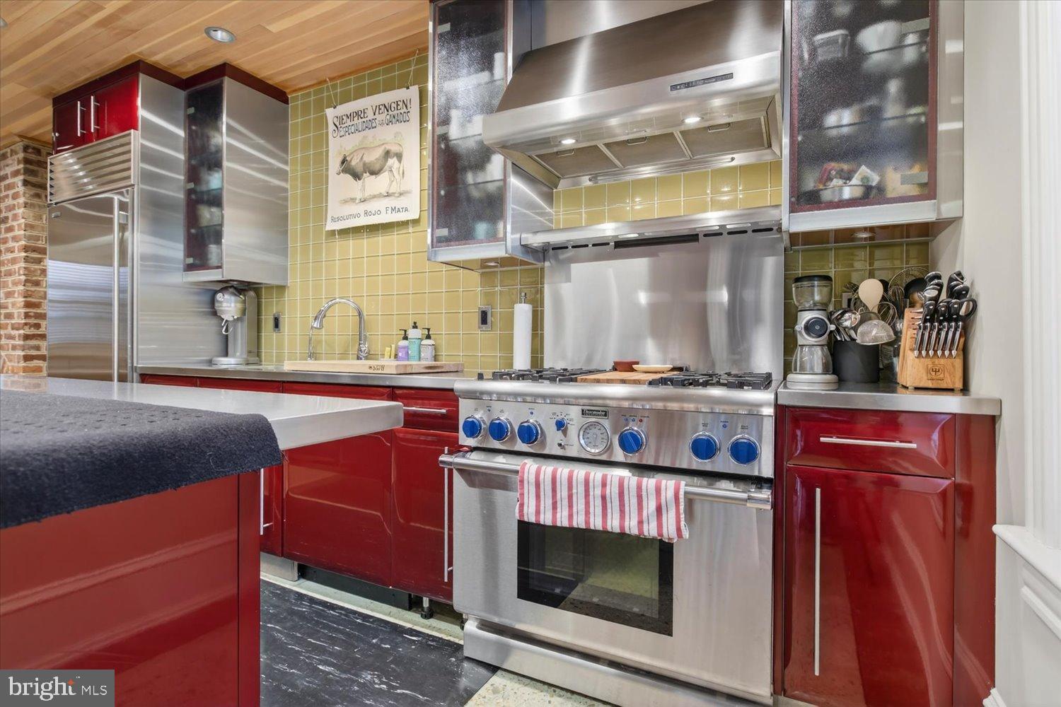 116 11th Street Northeast Washington, DC 20002 - Photo 20 of 40 Sleek modern kitchen with vibrant accents.