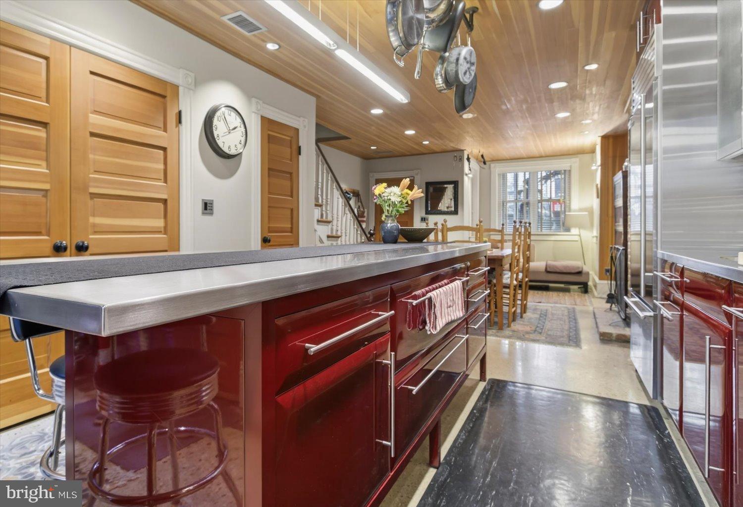 116 11th Street Northeast Washington, DC 20002 - Photo 21 of 40 Sleek kitchen with vibrant red accents.
