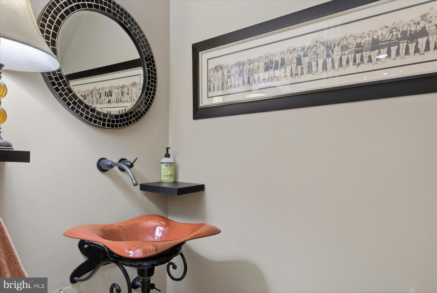 116 11th Street Northeast Washington, DC 20002 - Photo 24 of 40 Chic powder room with artistic flair.