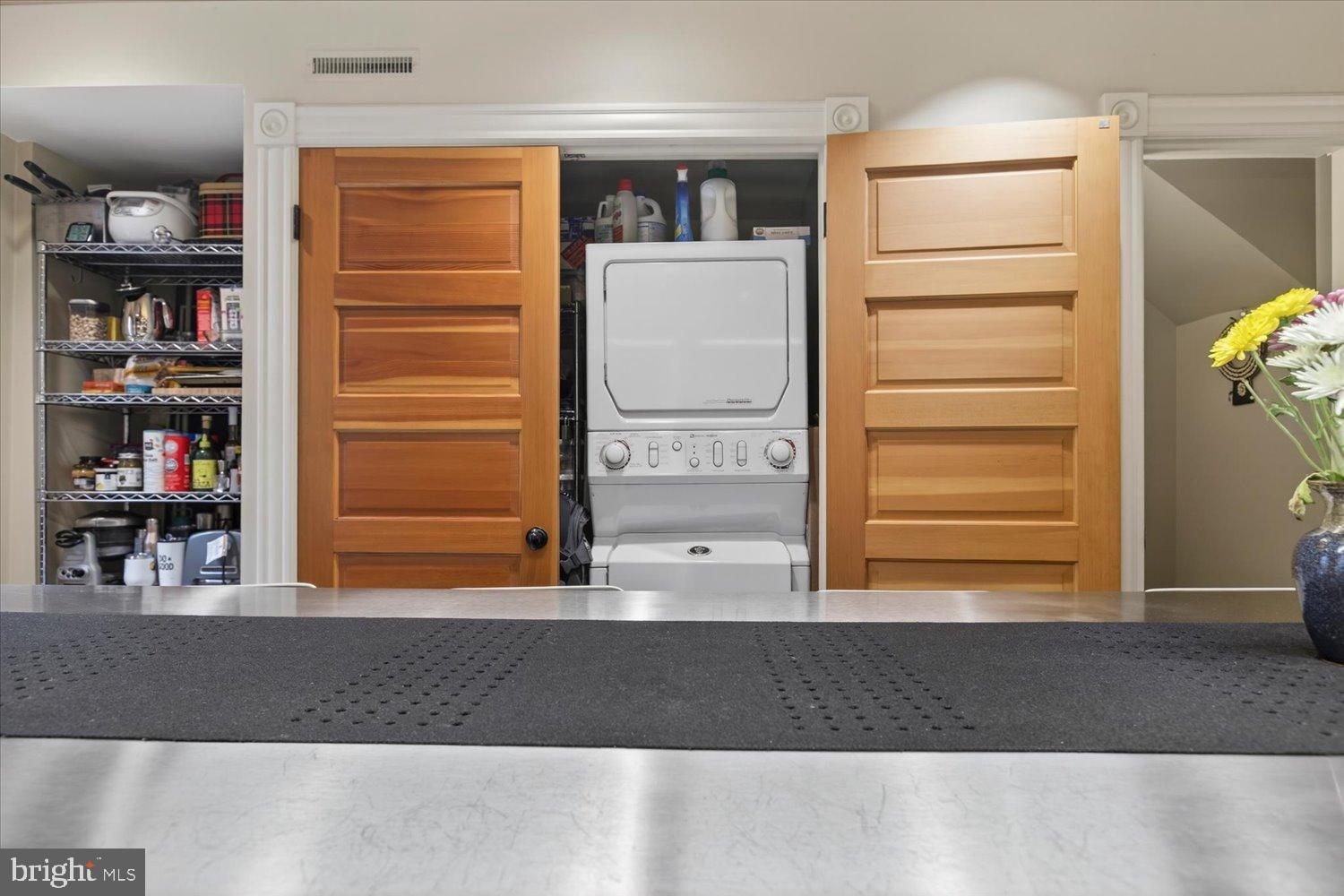 116 11th Street Northeast Washington, DC 20002 - Photo 25 of 40 Laundry nook with charming wooden doors.