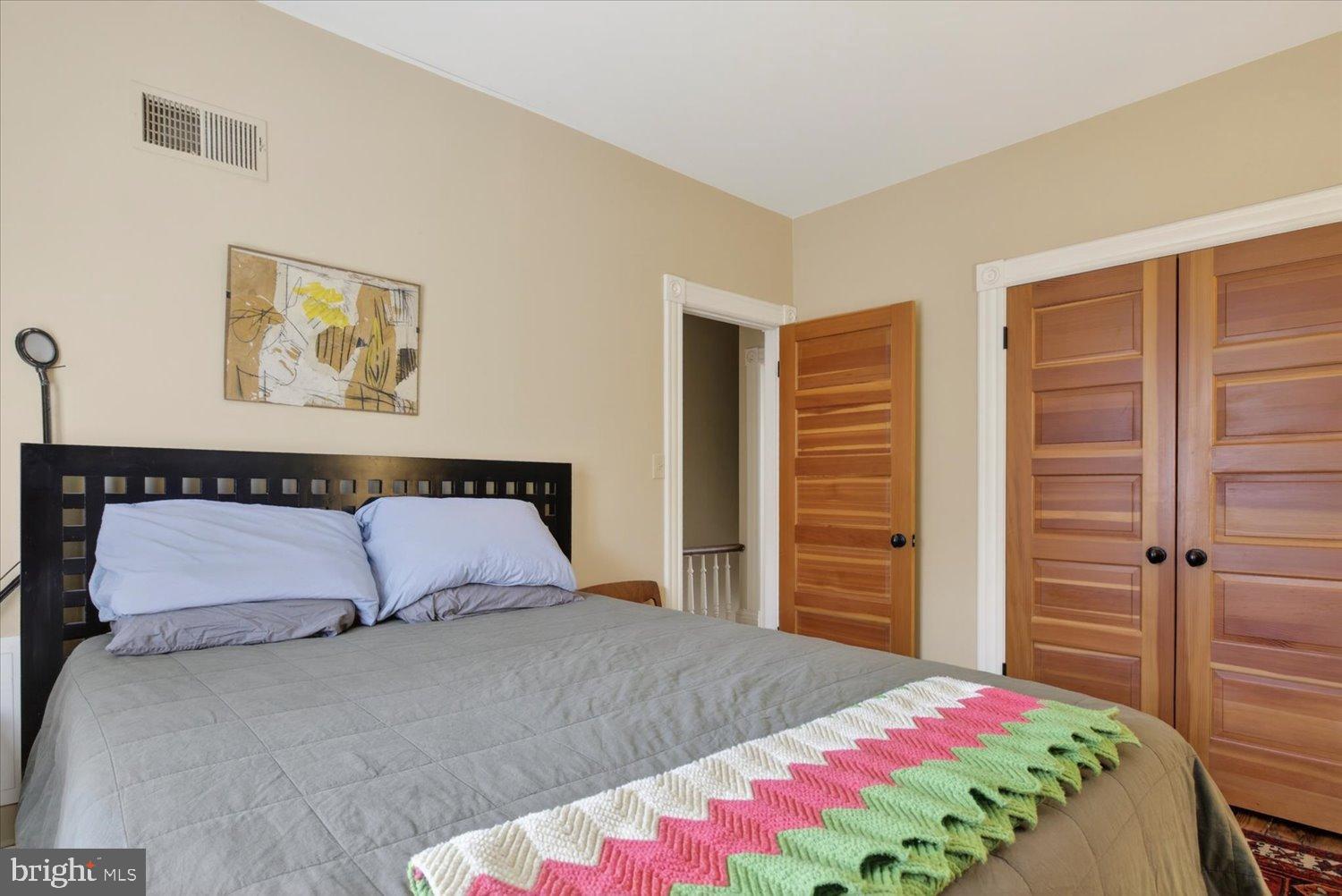 116 11th Street Northeast Washington, DC 20002 - Photo 36 of 40 Cozy bedroom with warm wooden accents.