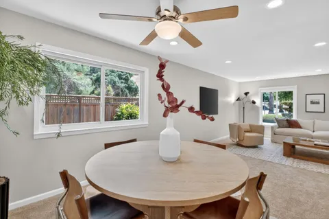 a kitchen with a sink cabinets stainless steel appliances and a window