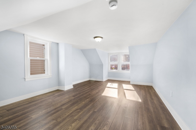 313 Mercer Street Phillipsburg, NJ 08865 - Photo 17 of 29 an empty room with wooden floor and windows