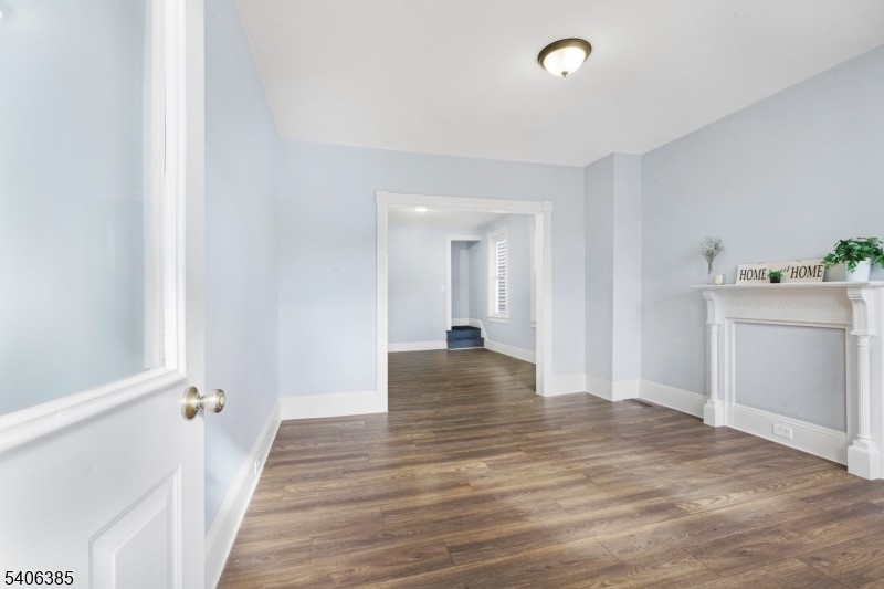 313 Mercer Street Phillipsburg, NJ 08865 - Photo 3 of 29 a view of a hallway with wooden floor and closet