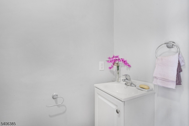 313 Mercer Street Phillipsburg, NJ 08865 - Photo 7 of 29 a bathroom with a sink and a mirror