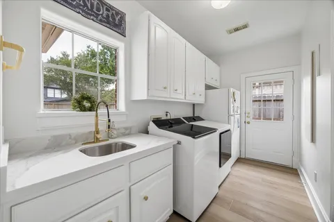 a kitchen with a sink and cabinets