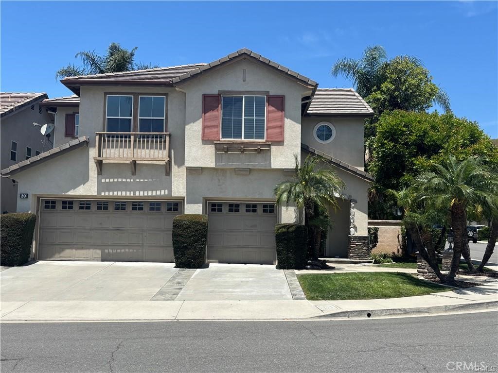 20 Berlamo Rancho Santa Margarita, CA 92688 - Photo 1 of 34 a front view of a house with a yard