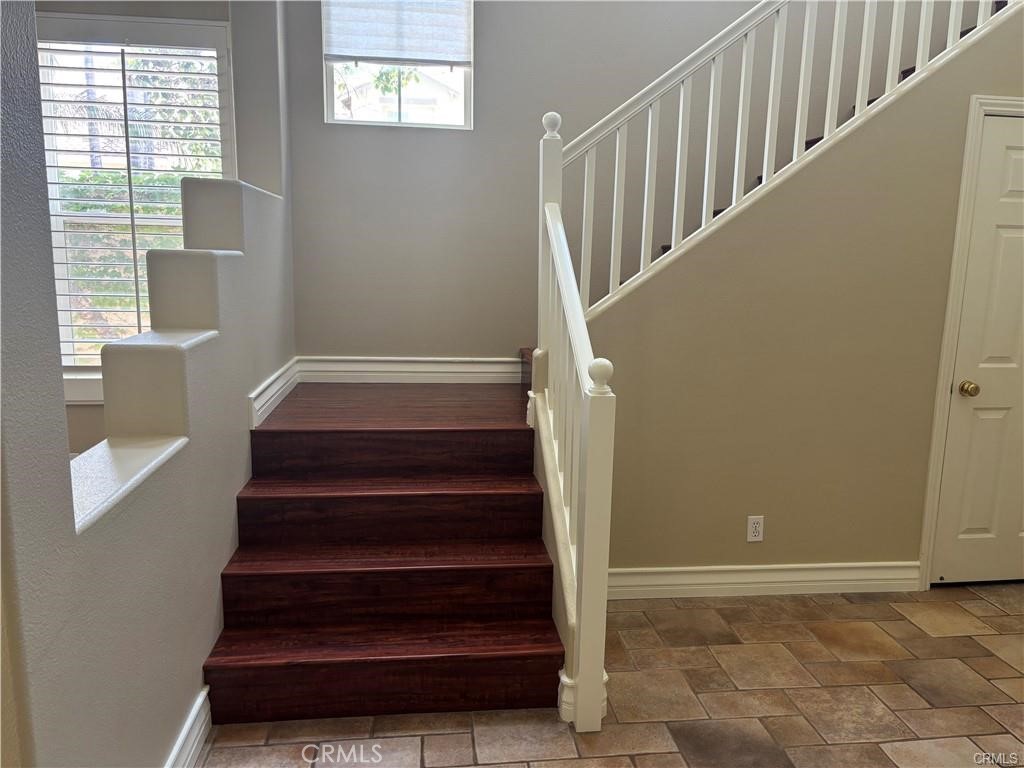 20 Berlamo Rancho Santa Margarita, CA 92688 - Photo 14 of 34 a view of entryway with wooden floor and front door