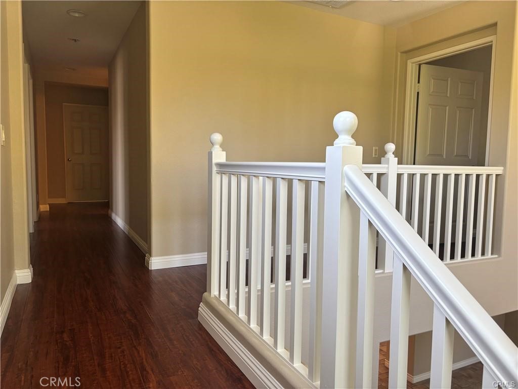 20 Berlamo Rancho Santa Margarita, CA 92688 - Photo 15 of 34 a view of a hallway with wooden floor