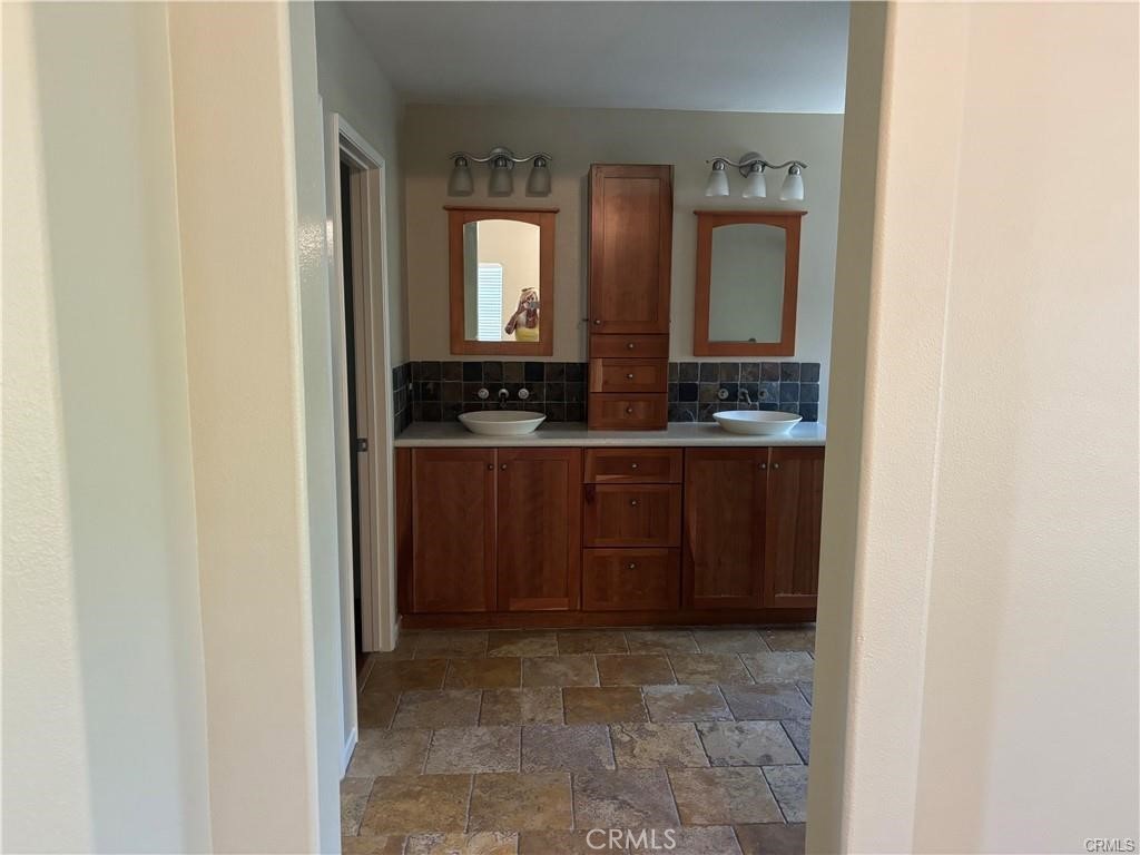 20 Berlamo Rancho Santa Margarita, CA 92688 - Photo 19 of 34 a bathroom with a sink and a mirror