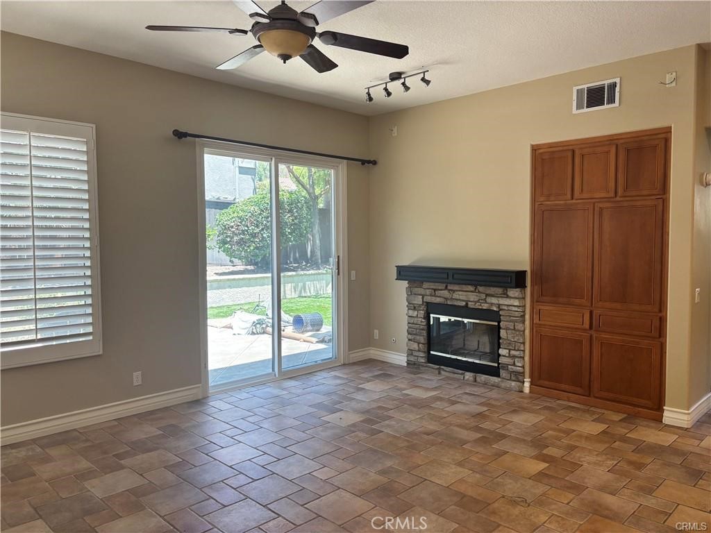 20 Berlamo Rancho Santa Margarita, CA 92688 - Photo 2 of 34 a view of an empty room with a fireplace and a window