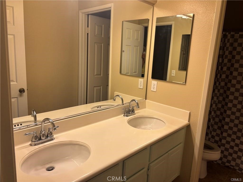 20 Berlamo Rancho Santa Margarita, CA 92688 - Photo 24 of 34 a bathroom with a sink and a mirror