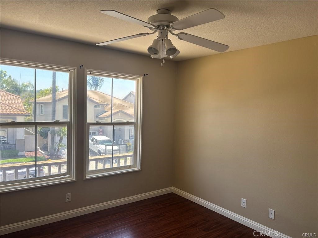 20 Berlamo Rancho Santa Margarita, CA 92688 - Photo 25 of 34 a view of an empty room with wooden floor and a window