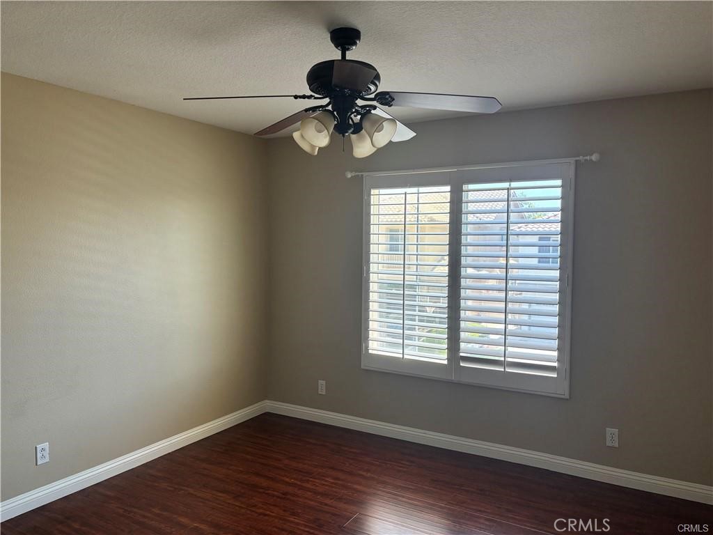 20 Berlamo Rancho Santa Margarita, CA 92688 - Photo 28 of 34 a view of an empty room with wooden floor and a window